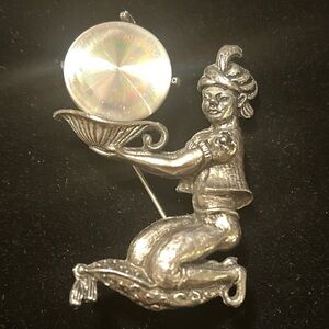 Silver Jewelarama brooch featuring a genie holding a lamp jewellery